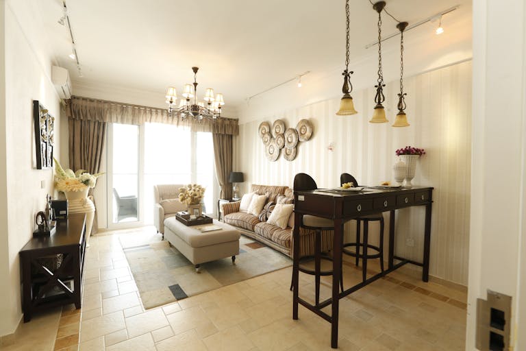 Explore this beautifully designed contemporary living room with modern furniture and elegant lighting.