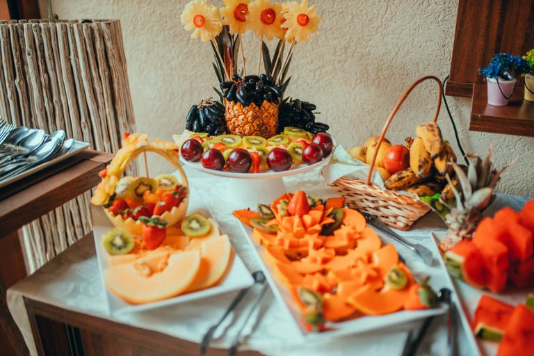 A beautifully arranged fruit platter showcasing colorful and fresh sliced fruits.