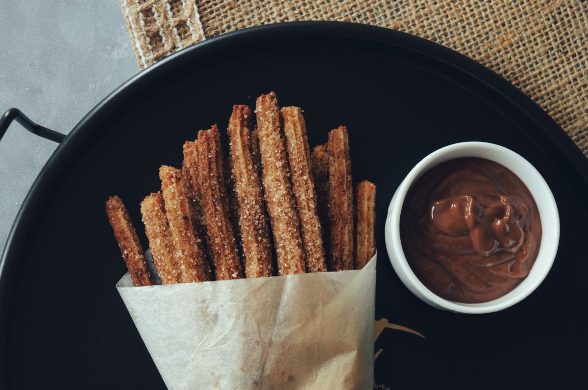 Chocolate dipped pretzel rods with dipping sauce